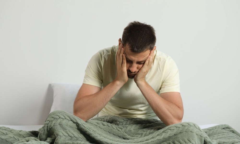 Doctor discussing testosterone blood test results with male patient