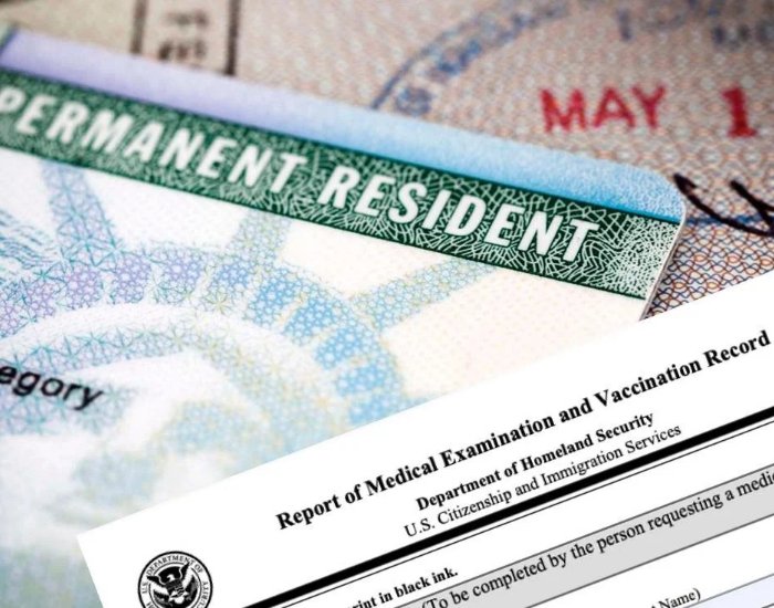 Form I-693 and a permanent resident card on a desk Form I-693 and a permanent resident card on a desk